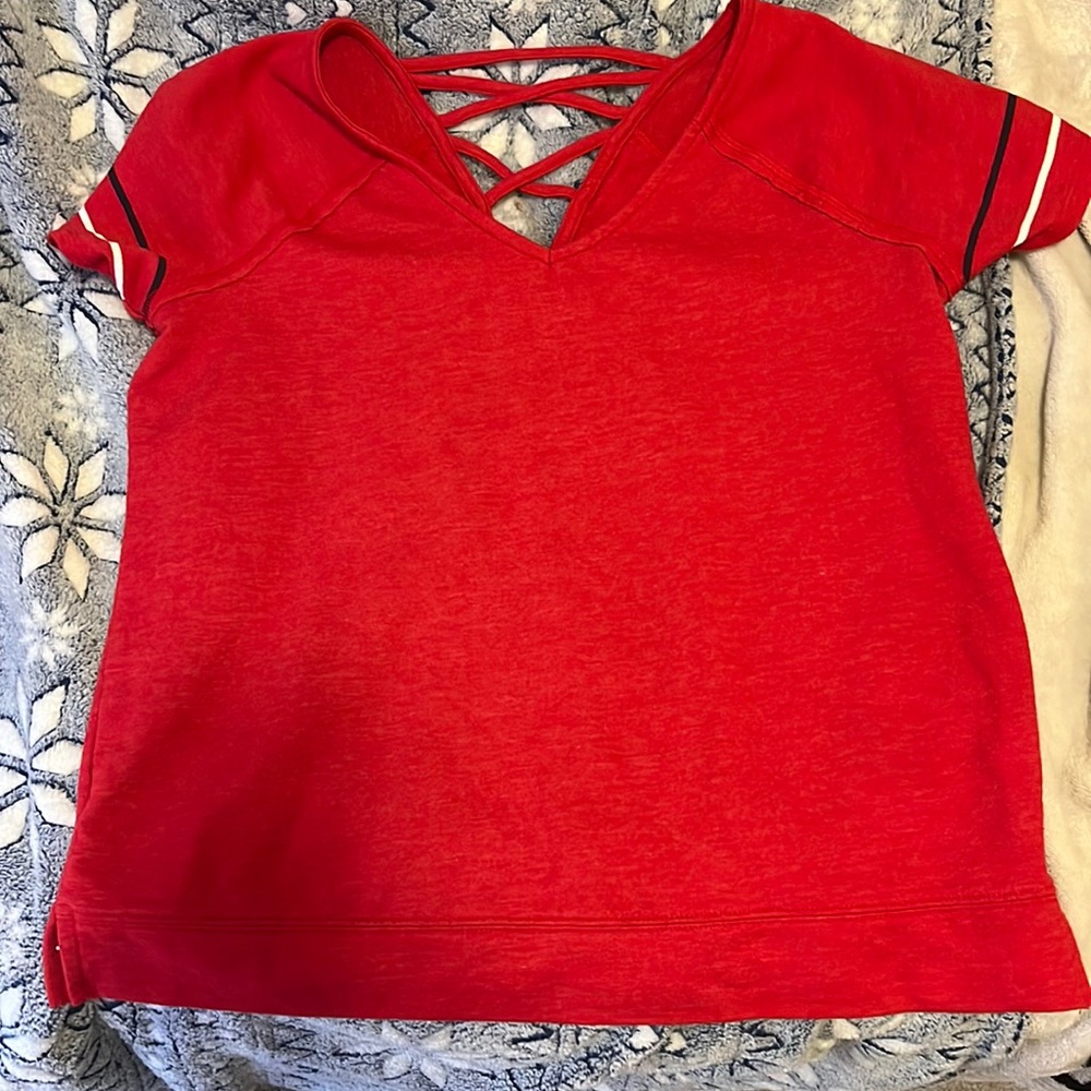 Red V neck short sleeved shirt